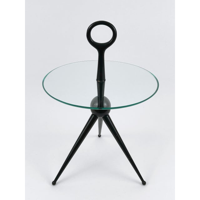Extremely rare, elegant and highly decorative Mid-Century Modern tripod side table. Designed and manufactured by Cesare...