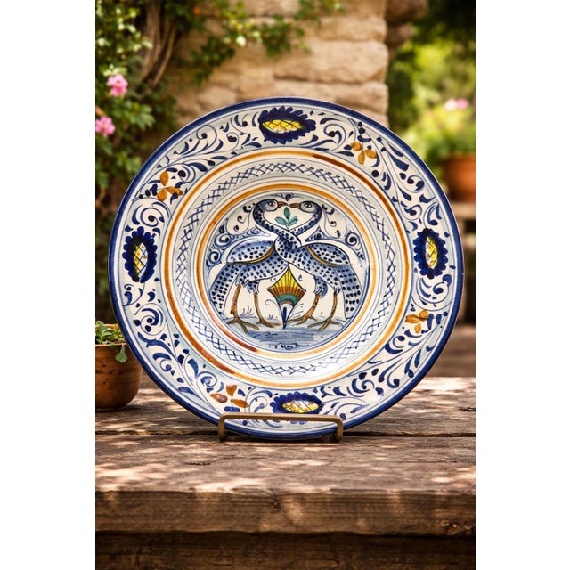 A hand-painted Italian majolica decorative plate by Verdiani Firenze in the “Decoro Arcaico” pattern. The design features...
