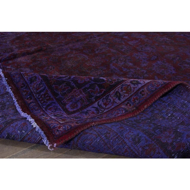 Beautiful Vintage Overdyed hand-knotted wool rug with a purple field. This Overdyed rug has a maroon accents in a gorgeous...