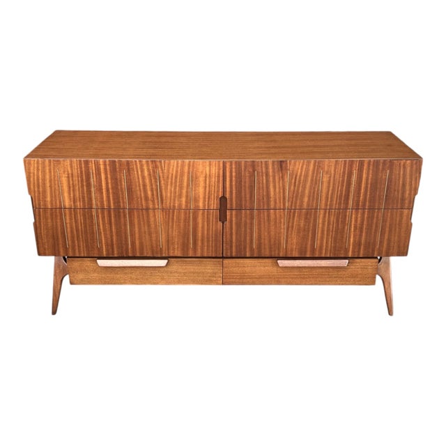 This striking mid-century modern credenza showcases the clean lines and sculptural elegance that define classic 1960s...