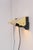 A pair of really beautiful and elegant mid-century modern Scandinavian atomic brass or gold colored wall lamps, also known...