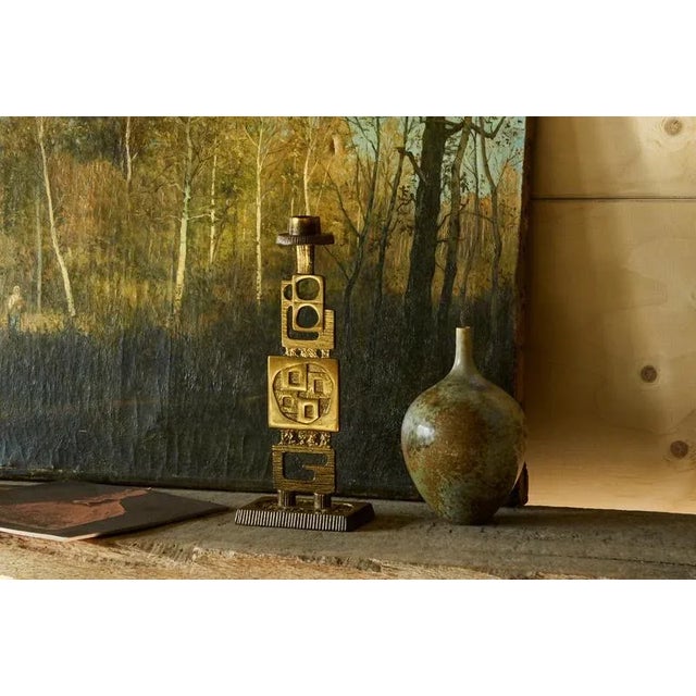 Brutalist Candle Holder in Patinated Brass. Mid 20th century, A very distinct mid century brutalist style candle holder in...