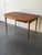 Authentic Mid-Century Modern Danish teak dining table with built-in drawers on both sides, circa 1960s. This beautifully...