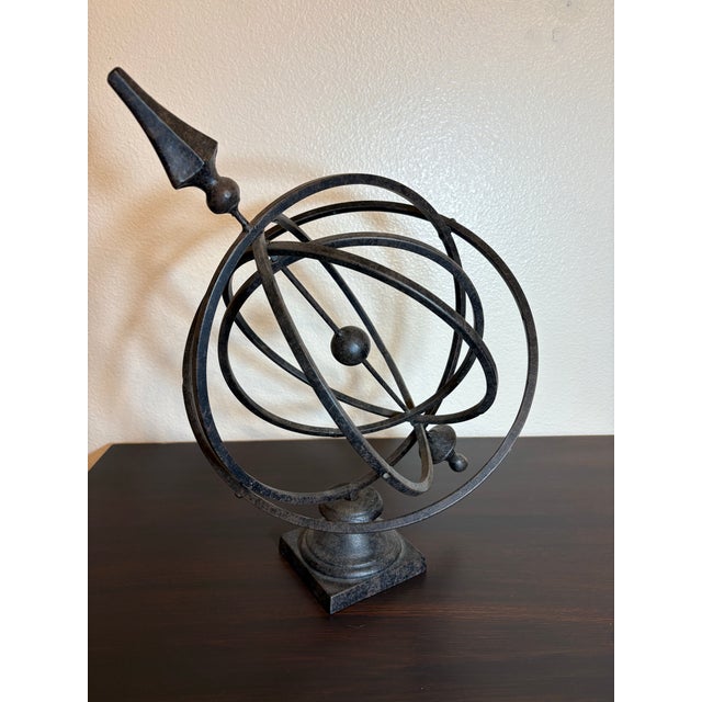 This piece of armillary is made of heavy iron and weighs approximately 4 pounds. The height of this armillary is 14 inches...