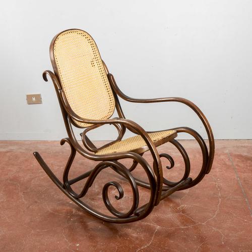 This rocking chair embodies the timeless elegance of the thonet style, an icon of period design that revolutionized...