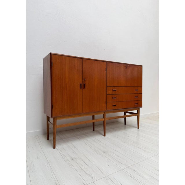 Elegant danish mid-century highboard attributed to børge mogensen, dating from the 1960s. crafted in teak with a...