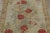 This antique 3x4 hooked rug, circa 1920–1929, features an elegant floral bouquet medallion framed by vivid red roses and...