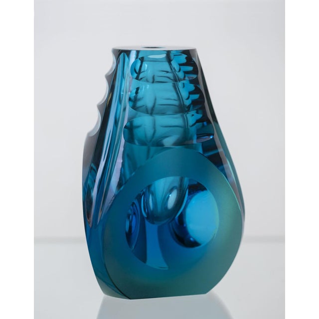 This hand-cut glass vase was produced in Czechoslovakia in the 1970s and reflects the modernist direction seen in...
