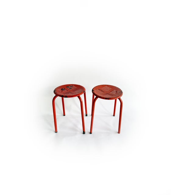Authentic French industrial stools made of steel with a beautifully aged patina. The perforated seat and minimalist...