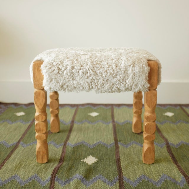 Scandinavian Modern Sheepskin stool in the style of Henning Henning Kjaernulf. Rectangular shape covered in plush...