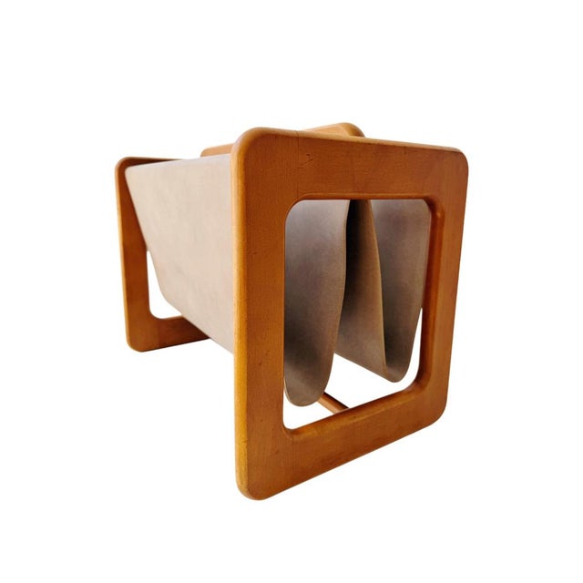 This vintage Danish magazine rack is designed by Aksel Kjersgaard and manufactured by Salin Møbler during the 1960s. A...