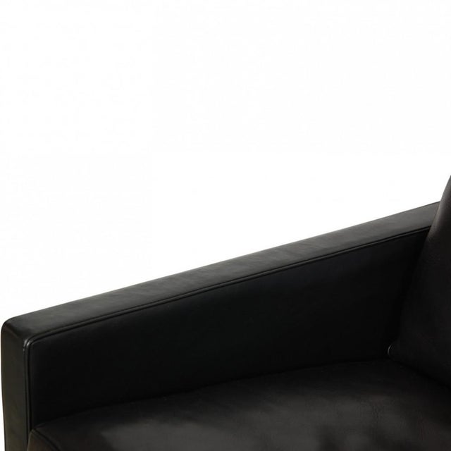 Poul kjærholm pk31 lounge chair upholstered in black leather, and with a frame of chrome spring steel. The chair is from...