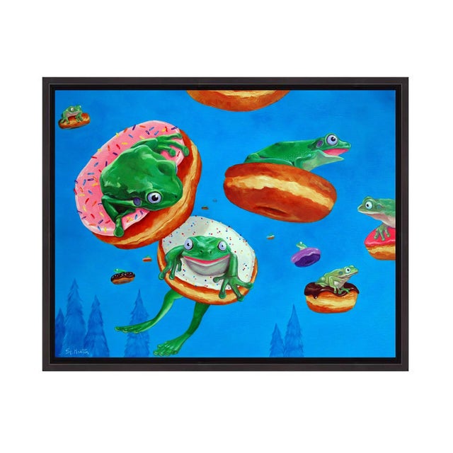 This whimsical oil painting features playful frogs lounging on oversized donuts against a vibrant blue background. The...