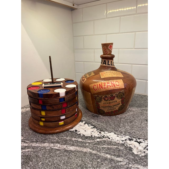 Outstanding mid century piece. Wooden decanter decorated with wine labels. Unscrew the stopper and lift the bottle off of...