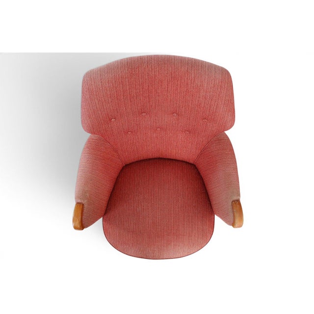 A magnificent matching pair of 1940s Scandinavian modern lounge chairs in original copper blush wool. Both chairs retain...