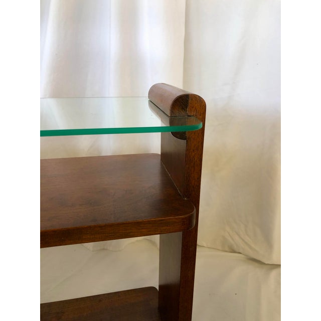 This pair of Art Deco end tables are elegant in design and structurally solid. The top is glass is set in place with the...