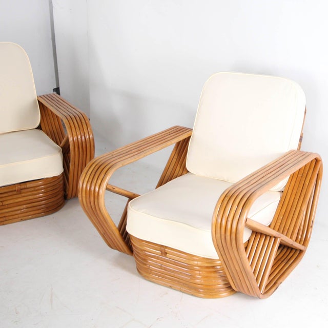 Exceptional rattan living room set by Paul Frankl, circa 1970. Comprising a modular three-piece sofa, two armchairs, and...