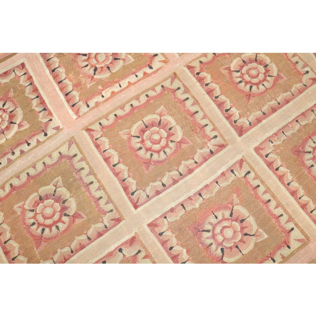 An 18th century worn French Aubusson tapestry Measures: 5'6'' x 7'4''.