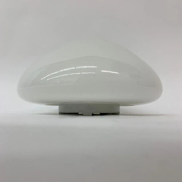 Classic ceiling or wall light after a design by Wilhelm Wagenfeld from the 1950s. A functional, elegant and therefore...