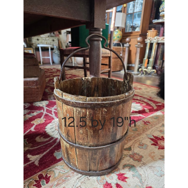 Antique rustic European wood bucket with iron straps and irone handle.