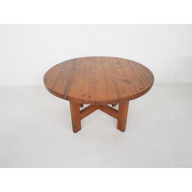 About this item Round solid pinewood dining table with a cross between the legs. Designed by Roland Wilhelmsson for Karl...