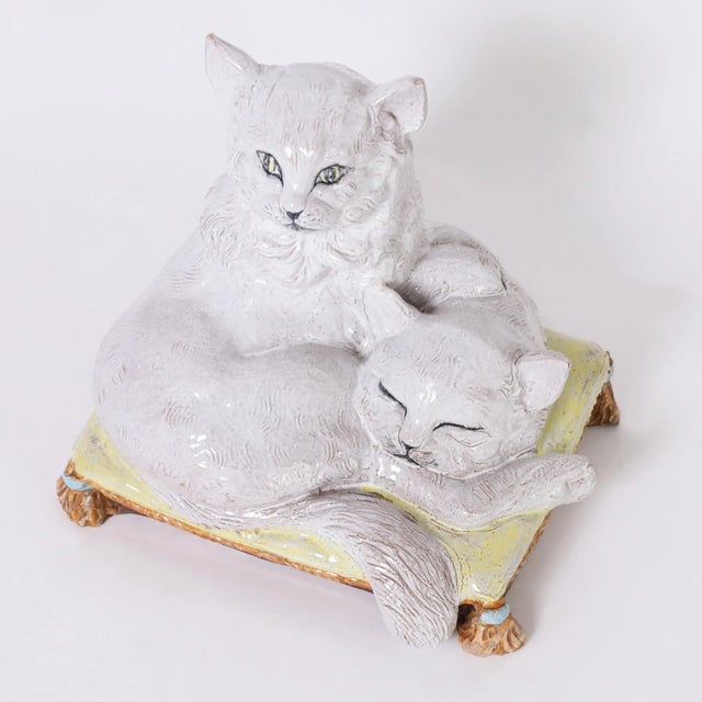 Delightful Italian sculpture of two white cats on a fancy pillow crafted in terra cotta, hand decorated and glazed for...