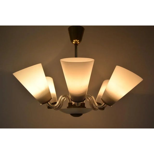 Made in czechoslovakia made of glass, milk glass, brass the chandelier was completely disassembled and cleaned, the wiring...