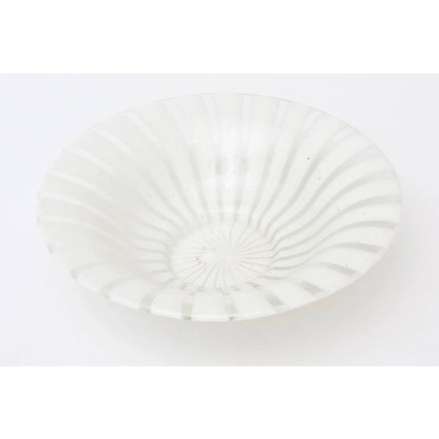 This beautiful vintage Italian Murano glass bowl is by Venini and has a pinwheel design with white lines. From the 60's....