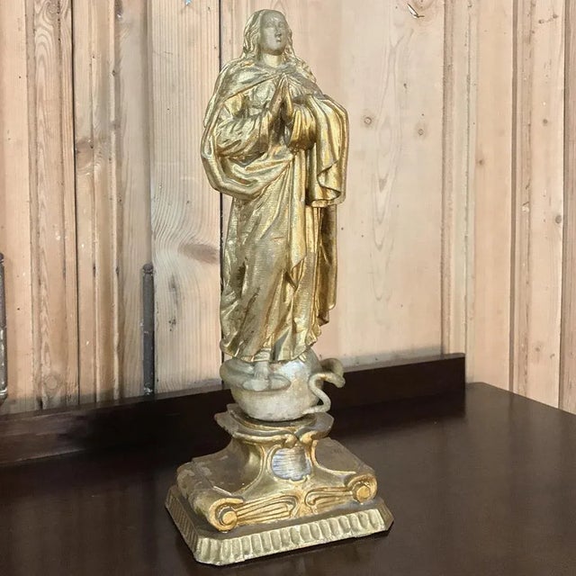 18th Century Italian Hand Carved and Painted Wood Madonna Statue depicts the Virgin Mary in contemplative prayer, and...