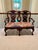Carved Settee with Needlepoint Seat Believed to be Maitland Smith, this double seat bench has ball and claw feet with...