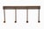 Industrial style wall hook rail with four peg hooks. It is made of wrought iron with a distressed rusted finish. It has a...