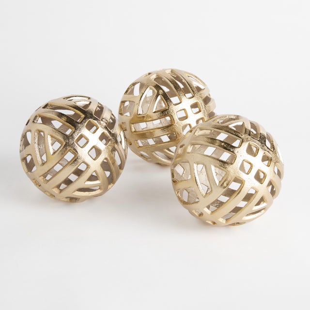 Weighted nicely in a cast aluminum open design, this set of 3 orbs are perfectly sized to style in bowls, trays, or on...