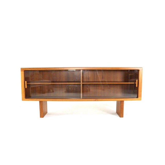 This sideboard by Silkeborg is a beautiful example of Danish design with a mid-century flair, crafted from high-quality...