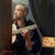 Backstage at the Cardamomo by Sheri Farabaugh | Oil on Board Man playing guitar in a dimly lit space. For Sale
