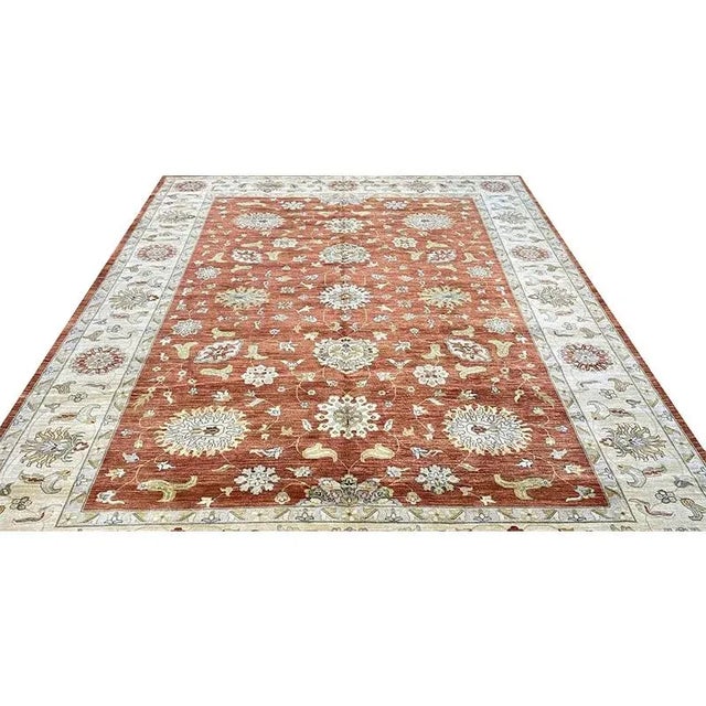 ACTUAL SIZE: 10’1″ x 14’4″ PRIMARY COLOR: Rust / Beige AGE: New ORIGIN: India MATERIALS: Wool FOUNDATION: Cotton...