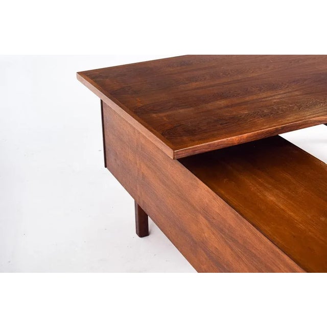 Danish rosewood desk with side cabinet. Stylish and functional, L-shaped, designed by Arne Vodder for Sibast. with four...
