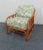 Mid century modern lounge chair , rattan frame with leather wrapped joints, grape vine patterned fabric