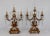Pair of Circa 1890 French Rococo Style Gilt Bronze and Crystal electrified Candelabras. Each candelabra has beautifully...