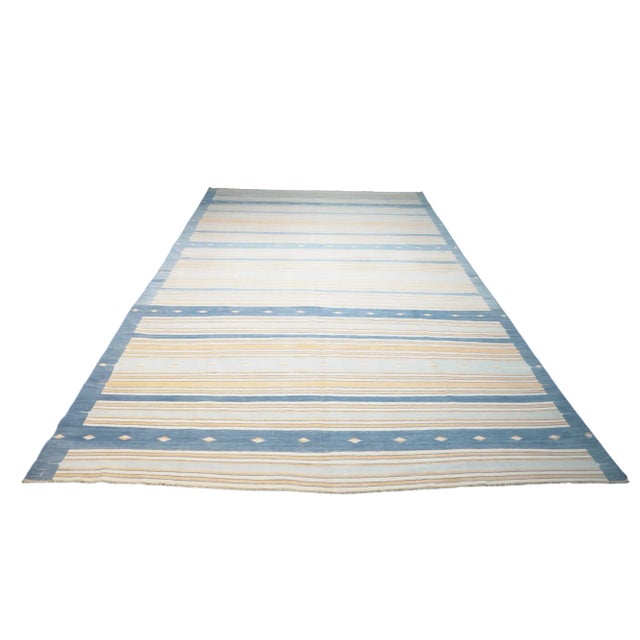 This vintage 8x13 Dhurrie flat weave is an exciting new entry in Rug & Kilim’s esteemed collection. Handwoven in wool, it...