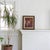 An abstract original painting with vibrant pops of bright orange, pink, and red amidst earthier tones of mauve, ochre, and...