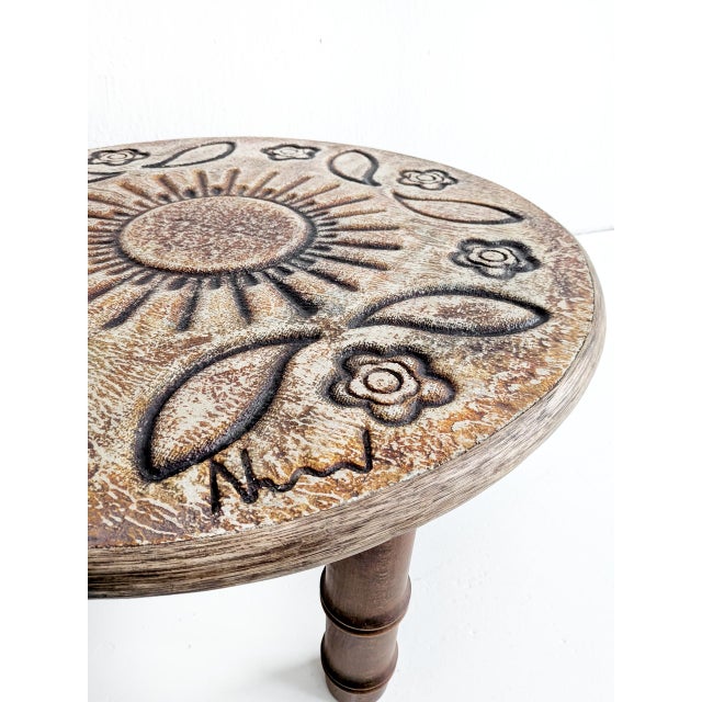 Round lavastone coffee table with wooden base, designed by François Chaty for Vallauris, 1960s. The top is signed by the...