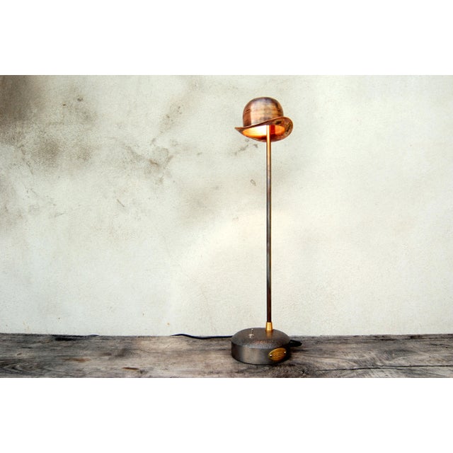This desk lamp is equipped with a built - in LED underneath the bowler hat in copper. Inspired by René Magritte, it has a...