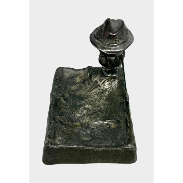 This is a vintage metal golfer figurine which often functions as a desk ornament, paperweight, or an ashtray/trinket dish....