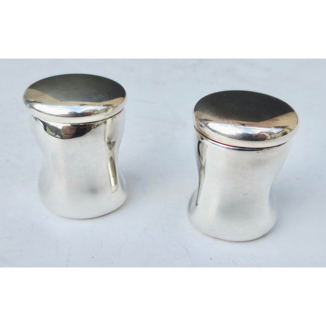 Sterling silver pill box with screw-on lid. Gilded inner well and lid. Hallmarked to the bottom Tiffany & Co. Elsa Peretti...