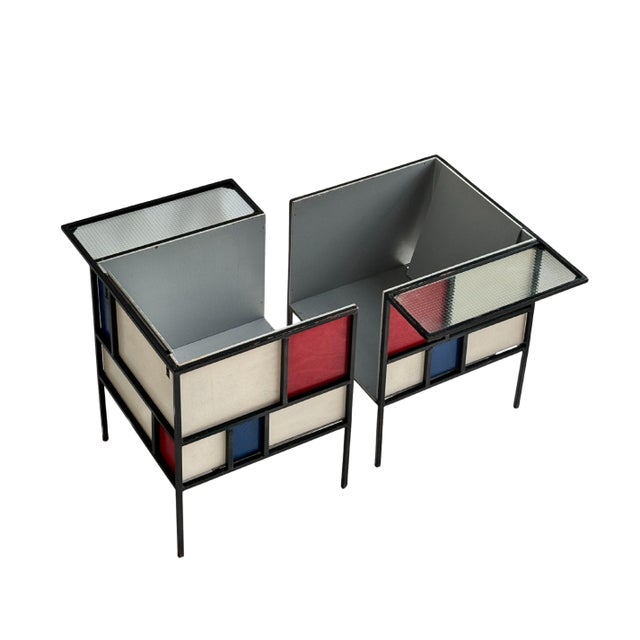 A magnificent pair of neoplasticist chairs dating from the 1940s, inspired by Mondrian's aesthetic and the formal...