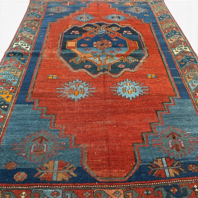 This exceptional antique Kazak rug, handwoven in Central Asia approximately 120 years ago, is a beautiful expression of...