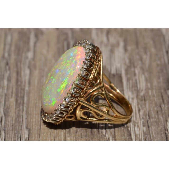 1960s The Lilly: Impressive 14 karat yellow and white gold ring set with a 22 carat Australian opal and diamonds For Sale - Image 5 of 11