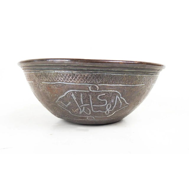 Small early 20th century handmade copper bowl with inlay silver Arabic calligraphy bowl. Middle eastern, overall dark...