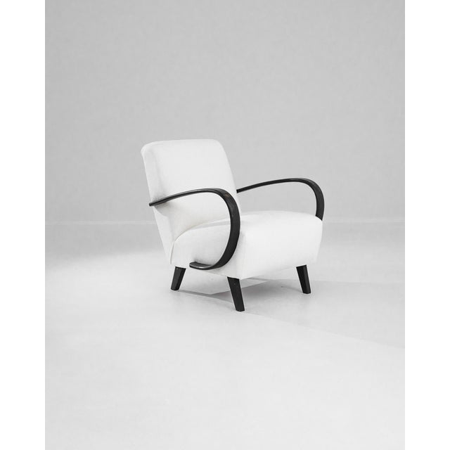 Add a touch of Art Deco elegance to your home with this stunning 1950s Czech Wooden Armchair by J. Halabala. Renowned for...