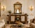 A remarkable expression of French Revival artistry, the Obsidian Bloom Sideboard and Mirror Set by Maison Velour...